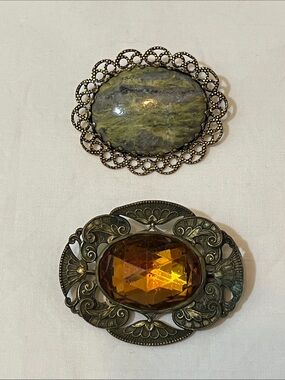 Green Marbled Stone and Amber Glass Ornate Brooches.